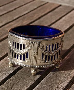 Oval silver plated salt cellar on 4 legs with deep blue glass insert by WMF