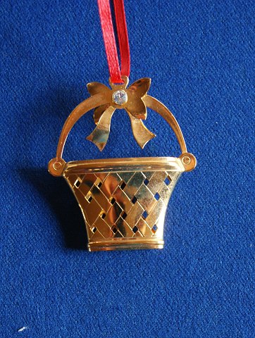 Georg Jensen Denmark Christmas ornaments in gilded brass. Christmas basket with red ribbon.