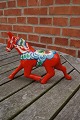 Red Dala horse in trot. One of the more rare dala 
horses from Sweden. 15 x 20cm
