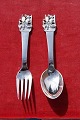 WE BUY: 
H.C.A fairy tales child's cutlery of Danish solid 

silver