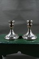 Pair of candlesticks 10cms on oval stand of sterling silver