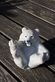 Royal Copenhagen Denmark Figurine 22747, lying 
bear cub with paws in the air