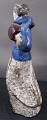 Michael Andersen Danish ceramics, Bornholm, in the series seasons. Young girl with blue jacket and muff, or winter